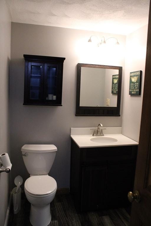 139 Wellman Ave Unit 139, Chelmsford, MA 01863 - half bathroom featuring vanity and wood finished floors