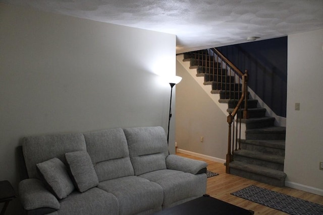 139 Wellman Ave Unit 139, Chelmsford, MA 01863 - living area with stairway and wood finished floors