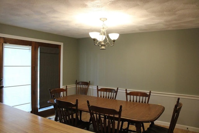 139 Wellman Ave Unit 139, Chelmsford, MA 01863 - dining area featuring a chandelier and wood finished floors