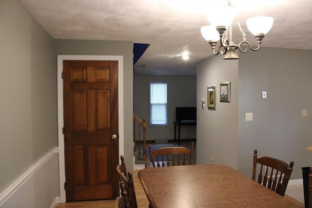 139 Wellman Ave Unit 139, Chelmsford, MA 01863 - dining space with a chandelier and baseboards