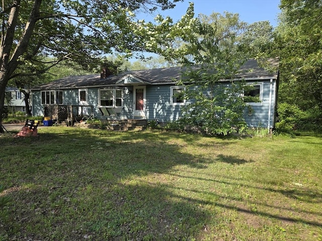417 Bigelow St, Marlborough, MA 01752 - view of front of home featuring a front yard and a chimney
