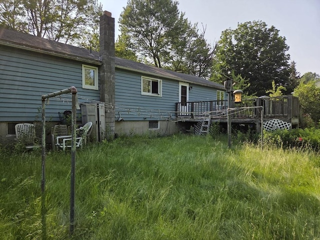 417 Bigelow St, Marlborough, MA 01752 - rear view of property featuring a chimney and a deck