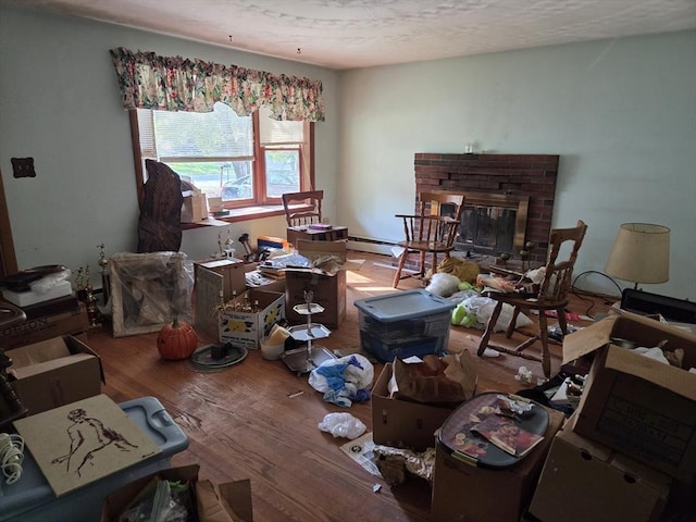 417 Bigelow St, Marlborough, MA 01752 - living room with wood finished floors and a brick fireplace