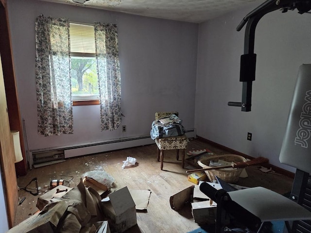 417 Bigelow St, Marlborough, MA 01752 - unfurnished room featuring baseboard heating and wood finished floors