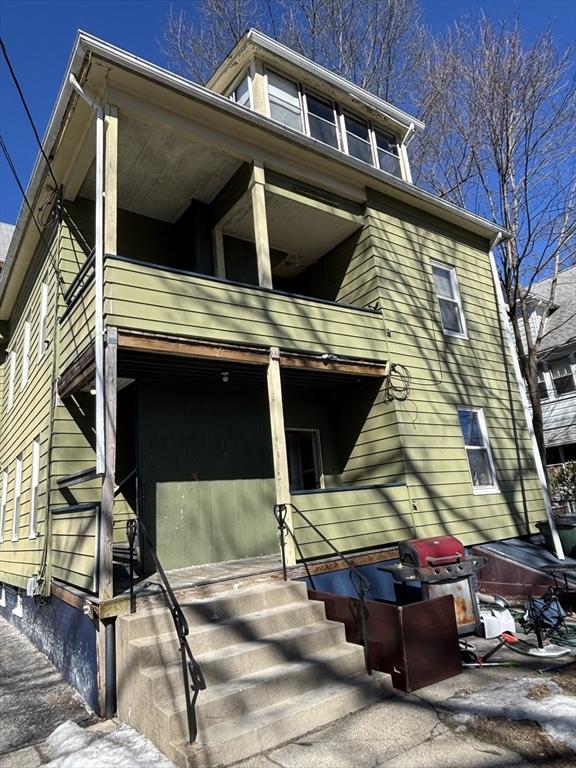 view of front of home with a balcony