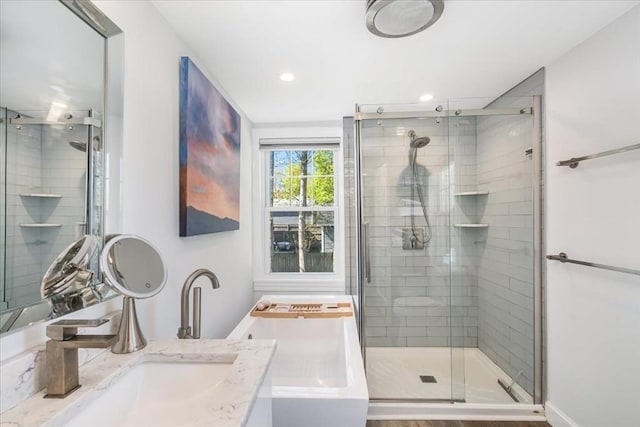bathroom with vanity, a shower stall, recessed lighting, and washer / clothes dryer