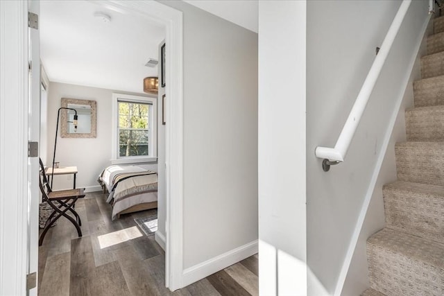 interior space featuring baseboards and wood finished floors