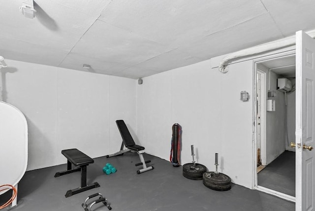 exercise room with an AC wall unit