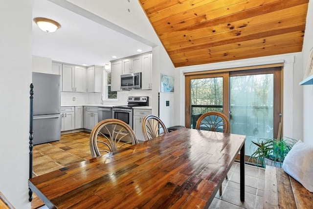 dining room featuring wooden ceiling, vaulted ceiling, and recessed lighting