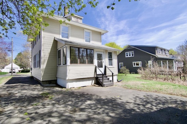 traditional style home featuring entry steps