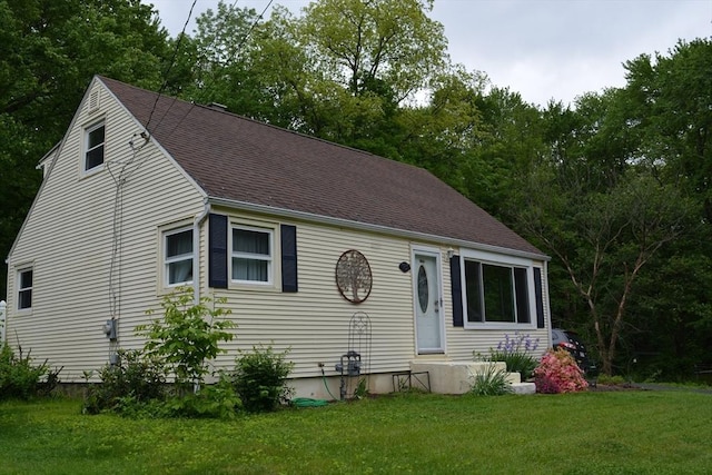 181 Adrian Ave, West Springfield, MA 01089 - view of front of property featuring a front yard and roof with shingles