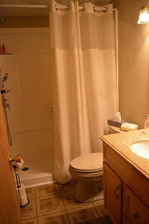181 Adrian Ave, West Springfield, MA 01089 - full bathroom featuring toilet, vanity, and a shower with shower curtain
