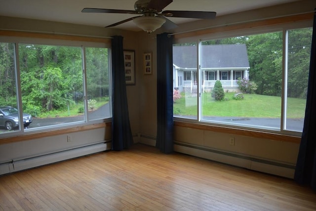 181 Adrian Ave, West Springfield, MA 01089 - unfurnished sunroom with plenty of natural light and a baseboard heating unit