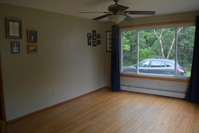 181 Adrian Ave, West Springfield, MA 01089 - empty room with a baseboard radiator, a ceiling fan, light wood finished floors, and baseboards