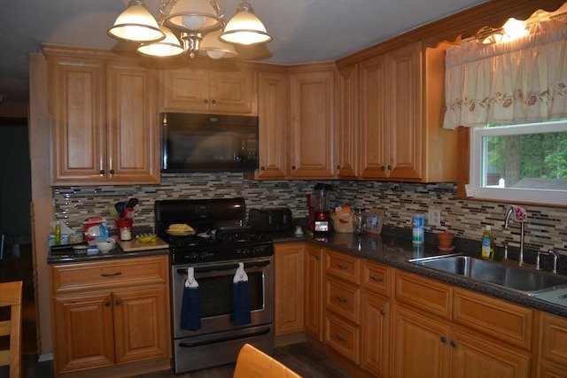 181 Adrian Ave, West Springfield, MA 01089 - kitchen featuring stainless steel gas range oven, black microwave, a sink, and decorative backsplash