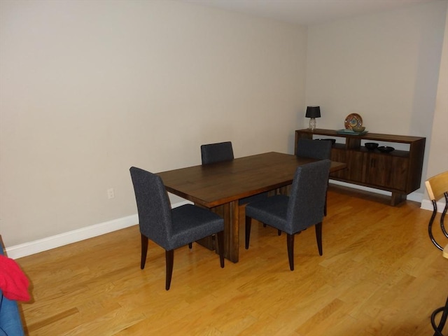 dining area with hardwood / wood-style flooring