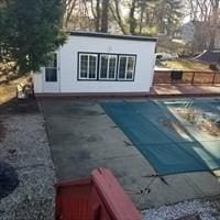 view of swimming pool with a patio area