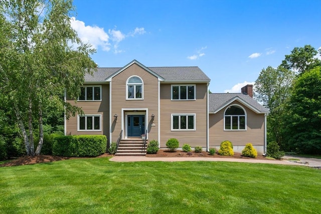 66 Ashcroft Rd, Sharon, MA 02067 - colonial home with a front lawn, a chimney, and a shingled roof