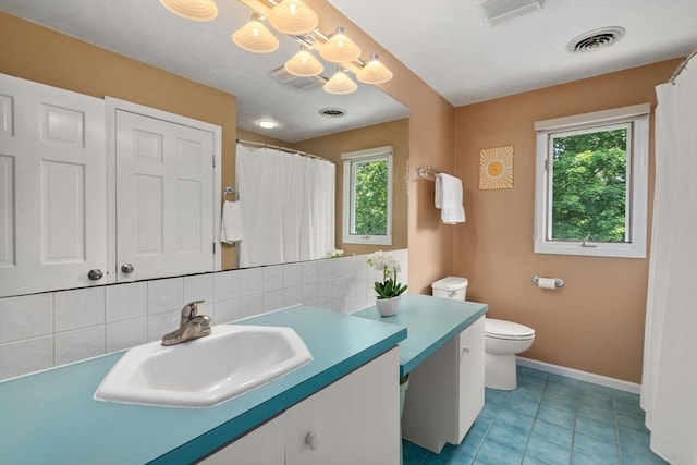 66 Ashcroft Rd, Sharon, MA 02067 - full bath featuring plenty of natural light, vanity, toilet, and a chandelier