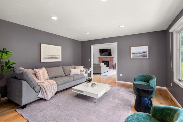 66 Ashcroft Rd, Sharon, MA 02067 - living room with light wood-style floors, baseboards, recessed lighting, and a brick fireplace