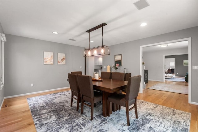 66 Ashcroft Rd, Sharon, MA 02067 - dining space featuring light wood finished floors, baseboards, recessed lighting, and a fireplace