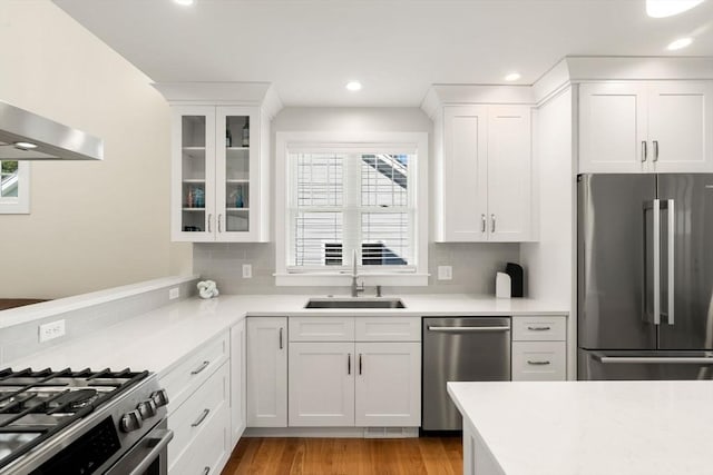 kitchen with light countertops, stainless steel appliances, and a sink
