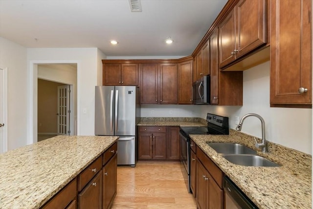1 Francis Dr Unit 211, Andover, MA 01810 - kitchen with stainless steel appliances, a sink, light wood-style flooring, light stone countertops, and recessed lighting