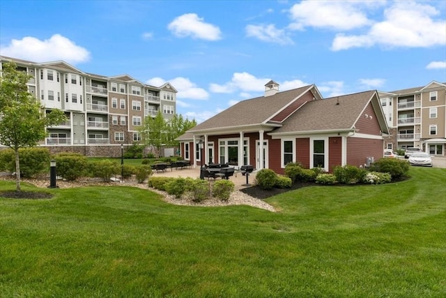1 Francis Dr Unit 211, Andover, MA 01810 - rear view of property featuring a yard, a patio area, and a chimney