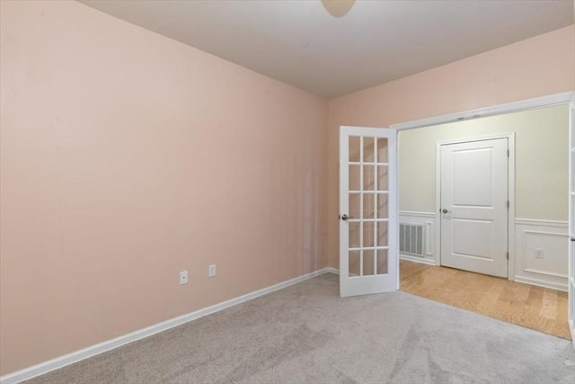 1 Francis Dr Unit 211, Andover, MA 01810 - empty room featuring light carpet, french doors, and baseboards