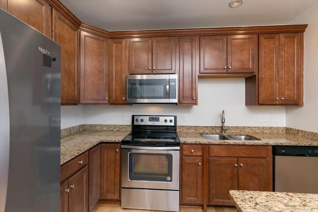 1 Francis Dr Unit 211, Andover, MA 01810 - kitchen featuring stainless steel appliances, a sink, and light stone counters