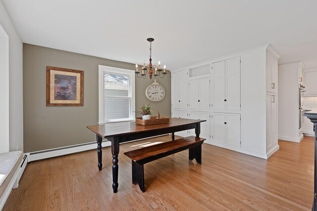 3 Squantum Rd, Paxton, MA 01612 - dining room featuring a chandelier, light wood finished floors, a baseboard heating unit, and baseboards