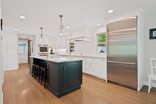 3 Squantum Rd, Paxton, MA 01612 - kitchen featuring appliances with stainless steel finishes, white cabinetry, light wood-type flooring, light countertops, and recessed lighting