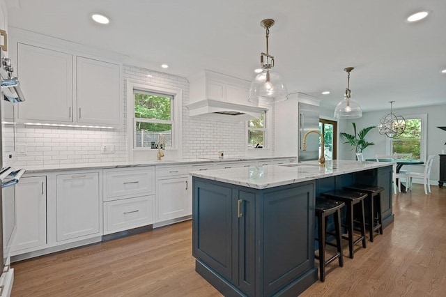 3 Squantum Rd, Paxton, MA 01612 - kitchen featuring white cabinets, plenty of natural light, light wood-style floors, and recessed lighting