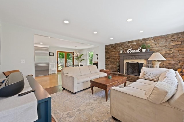 3 Squantum Rd, Paxton, MA 01612 - living room featuring recessed lighting, light wood-style floors, and a fireplace with raised hearth