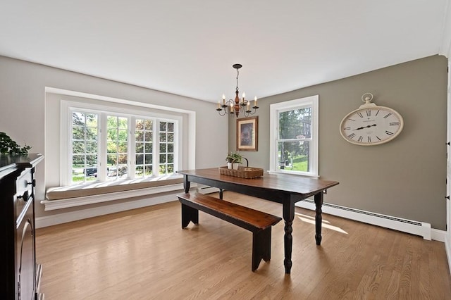 3 Squantum Rd, Paxton, MA 01612 - dining space featuring a baseboard radiator, a chandelier, light wood-style floors, and baseboards