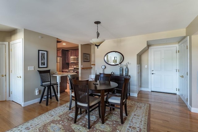 dining room with hardwood / wood-style floors