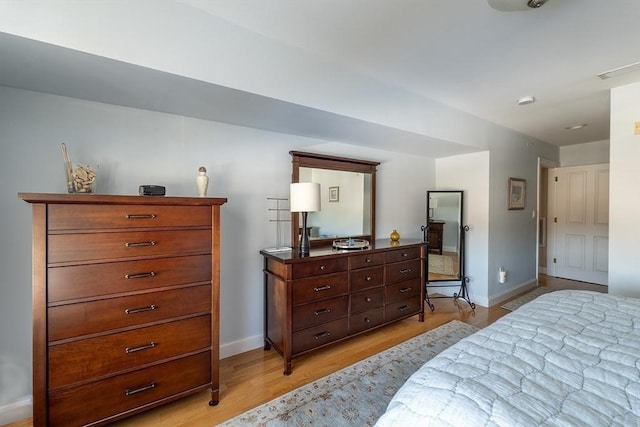 bedroom with light wood-type flooring