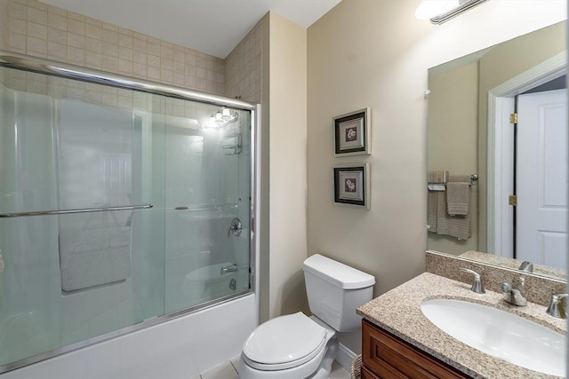 full bathroom with toilet, enclosed tub / shower combo, and vanity