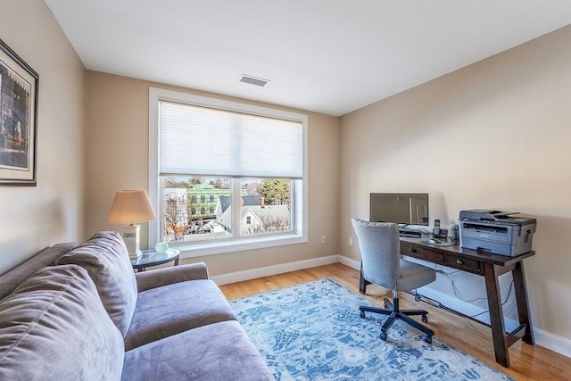 office space with light hardwood / wood-style floors