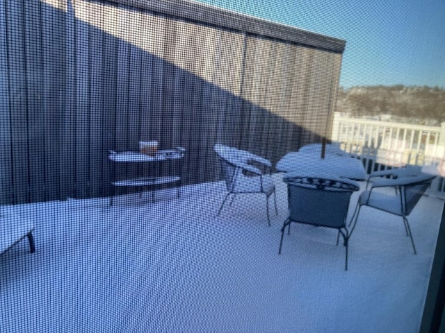 view of snow covered patio