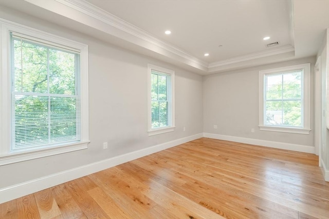 kitchen featuring light hardwood / wood-style floors, kitchen peninsula, appliances with stainless steel finishes, pendant lighting, and white cabinets