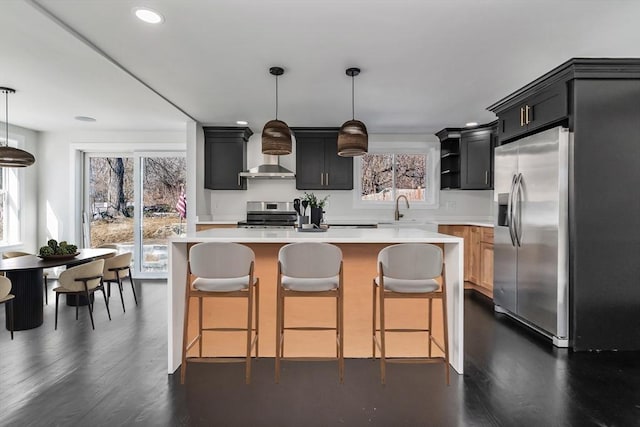 kitchen featuring a kitchen bar, light countertops, dark wood-style flooring, stainless steel appliances, and open shelves