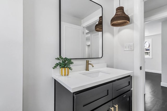 bathroom with vanity and baseboards