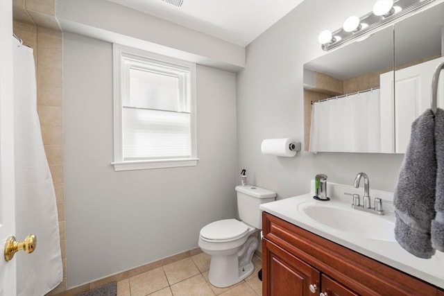 8 Brinton St Unit 2, Boston, MA 02119 - bathroom with vanity, toilet, tile patterned flooring, a shower with shower curtain, and baseboards