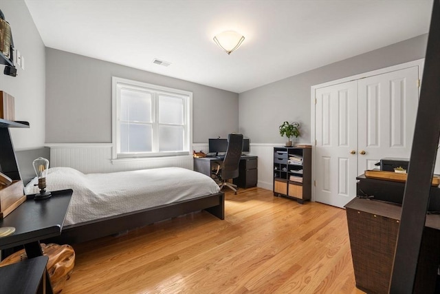 8 Brinton St Unit 2, Boston, MA 02119 - bedroom with an office area, wainscoting, light wood finished floors, and a closet
