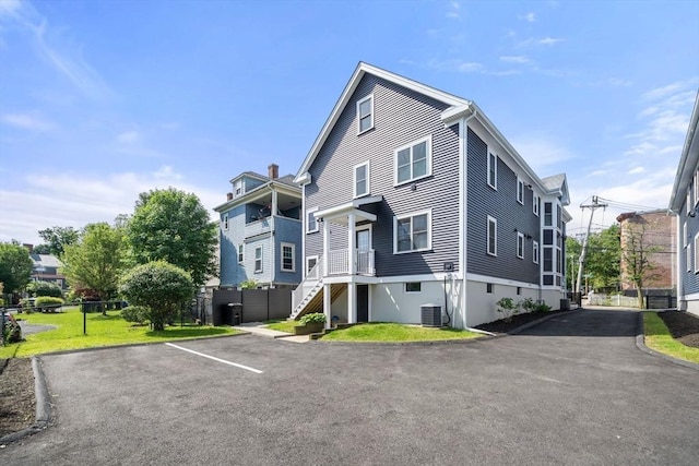 8 Brinton St Unit 2, Boston, MA 02119 - view of property exterior with cooling unit and uncovered parking