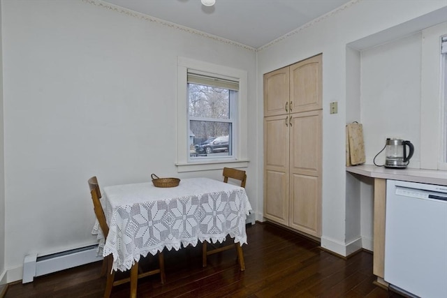 dining room featuring a baseboard heating unit, dark wood-style floors, and baseboards