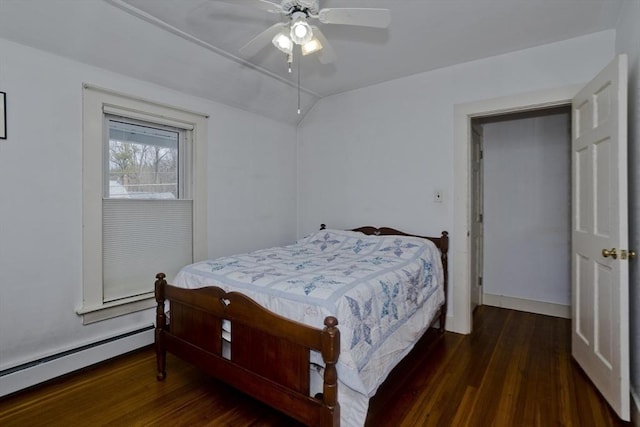 bedroom with ceiling fan, a baseboard heating unit, lofted ceiling, and wood finished floors