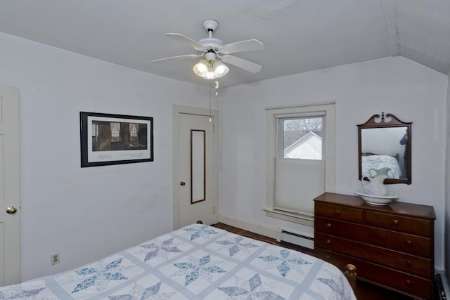 bedroom with a baseboard heating unit, ceiling fan, and vaulted ceiling