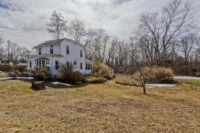 view of property exterior featuring a yard